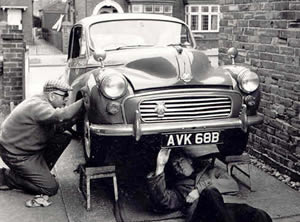 Richard and Dad servicing the Morris Minor